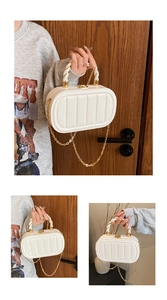 Detailed view of cream-white quilted crossbody bag with rope handle and gold chain strap