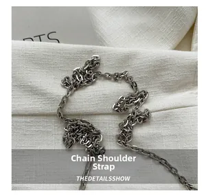 Close-up of polished silver metal chain strap for stylish crossbody square box handbags
