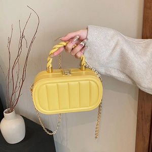 Fashionable bright yellow quilted crossbody bag with gold chain and top handle for women