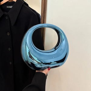 Chic electric blue metallic acrylic crescent handbag with circular cutout handle for evening
