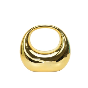 Modern minimalist gold electroplated hollow oval ceramic ornament with a mirrored finish