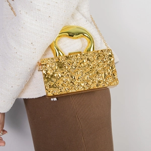Elegant gold acrylic clutch bag with lava texture and metal handle for women's evening wear