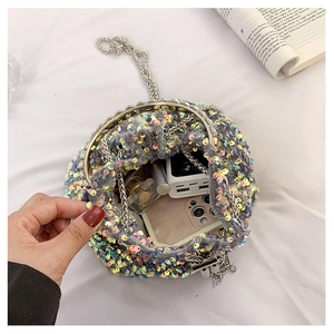 Internal view of sequined bucket bag showing space for phone and makeup items