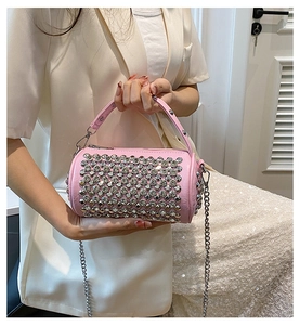 Detail of pink rhinestone bowling bag featuring silver chain strap and sparkling crystals