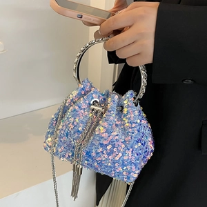 Sparkly blue sequin bucket bag with silver metal ring handle and fringe chain details