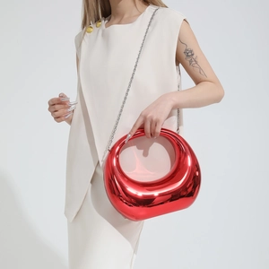 Metallic red circular moon bag with silver chain strap and mirrored finish for women