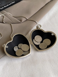 Polished silver heart-shaped mini acrylic crossbody bag with metal chain and magnetic closure