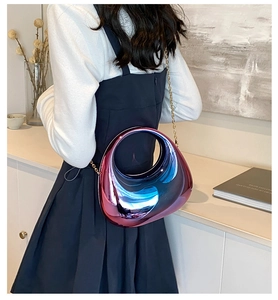 Iridescent acrylic crescent moon bag with a sleek metallic gradient and gold chain strap