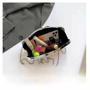 Interior view of the acrylic stone clutch bag showing capacity for phone and cosmetics