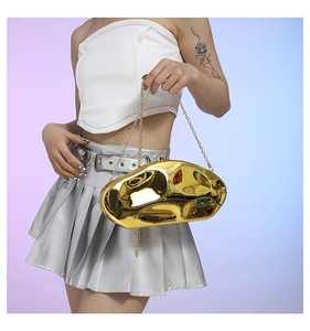 Futuristic gold acrylic box clutch with liquid metal texture on a gold chain strap