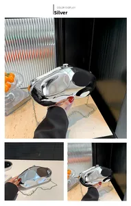 Silver metallic pebble-shaped acrylic clutch bag with a detachable chain strap