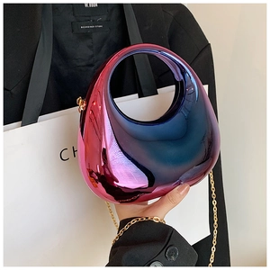 Detail of metallic gradient acrylic moon bag with gold chain and round handle