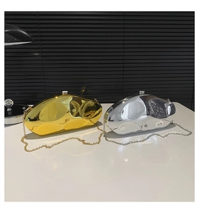 Close-up of cloud-shaped metallic acrylic box bags in gold and silver with mirror finish