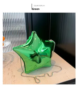Detail view of star-shaped acrylic evening bag in vibrant green with silver chain strap