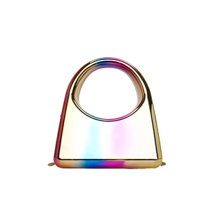 Close-up of holographic gradient acrylic evening bag with metallic finish and round handle