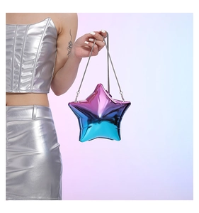 Close-up of star-shaped acrylic evening bag with gradient purple metallic finish