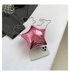 Pink star-shaped acrylic evening bag size comparison with a smartphone and silver chain