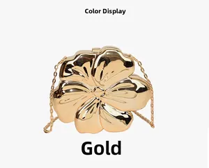 Detail of flower-shaped gold evening bag featuring polished finish and chain strap