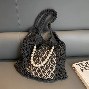 Black hollow crochet tote bag with pearl chain and canvas lining for summer beach