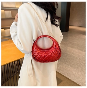 Red metallic quilted shell bag with round top handle and gold chain shoulder strap