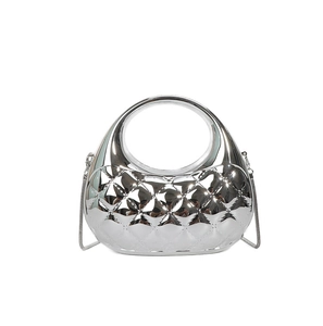 Detail of silver metallic seashell clutch with quilted pattern and chain strap