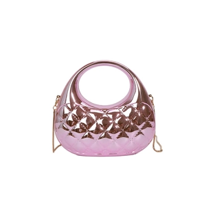 Pink metallic shell clutch featuring a diamond quilted texture and golden chain strap