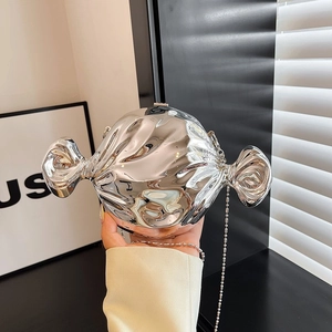 Silver candy-shaped evening clutch bag with metallic mirror finish and chain strap