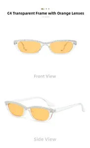 Détail de lunettes de soleil œil-de-chat avec sourcil serti de cristaux et verres orange