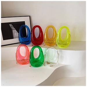 Group of colorful acrylic evening clutch bags with gold chains in various vibrant colors