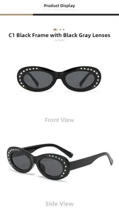 Detail view of oval sunglasses with black frames and colorful rhinestones inlay