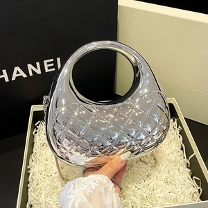 Silver mirror finish cloud shell clutch with diamond quilted pattern and metal chain strap