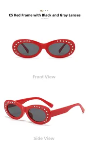 Detail of red oval sunglasses with colorful rhinestones and dark grey lenses