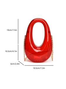 Transparent red acrylic pebble evening bag with size dimensions and gold chain strap