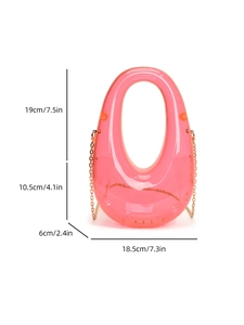 Detail showing dimensions of pink acrylic oval bag with a gold chain strap
