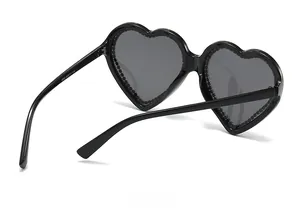 Detail view of heart-shaped sunglasses showing model 8030 and size specs on the temple