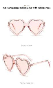 Detail view of pink heart-shaped sunglasses with sparkling rhinestone-studded frame