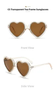 Detailed front and side view of heart-shaped sunglasses with rhinestone-studded tea frames