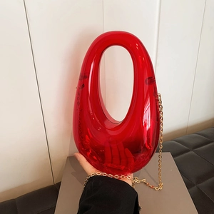 Transparent red acrylic evening clutch bag with elegant gold chain for women party use