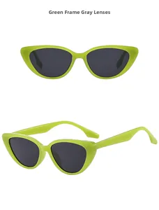 Detail view of cat eye sunglasses featuring green frames and dark gray lenses