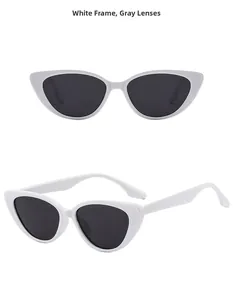 Detail view of cat eye sunglasses featuring white frames and dark gray lenses