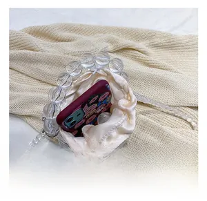 Internal capacity of the clear acrylic beaded bucket bag with drawstring pouch