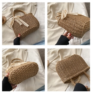 Detail of woven straw handbag featuring elegant white lace ribbon and bow decoration