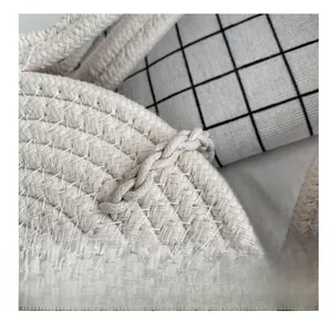 Macro shot of high-density stitching on ivory hand-woven bag with thick handle details
