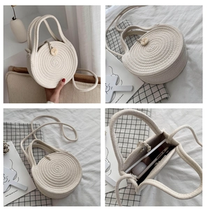 Detail showing the thick rope weave and wooden button closure of this round crossbody bag
