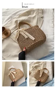 Detail of khaki straw handbag featuring a delicate lace bow and woven round handle