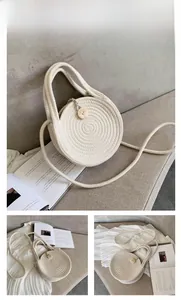 Detail of round cream-colored woven bag with wooden button and braided shoulder strap