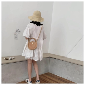 Summer vacation outfit with white puff sleeve dress, round straw bag and wide brim hat