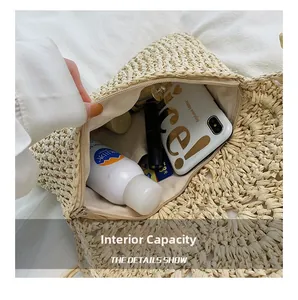 Internal view of handmade straw beach bag showing zipper closure and large capacity