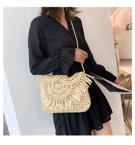 Fashionable straw crossbody bag with long tassels and handmade woven texture details