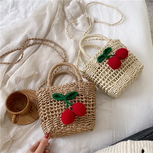 Handmade cherry straw beach bag with crossbody strap in beige and natural brown colors